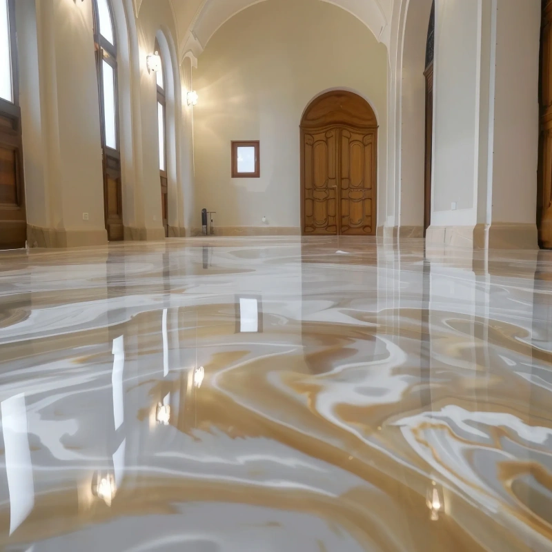 A luxurious and highly reflective epoxy flooring in Dubai, featuring a mesmerizing swirl pattern of white, beige, and gold